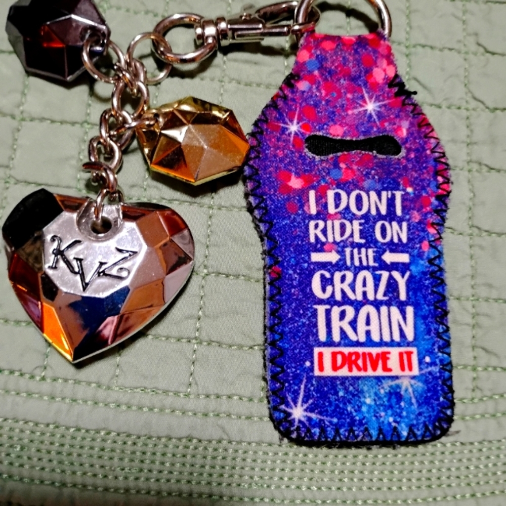 Kathy brand 10 inch Silver Keychain, it has a multi colored cloth tag